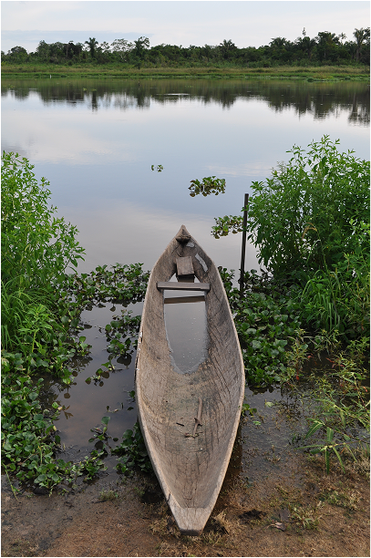 A home made canoe, caved out of a single wooden tree.
