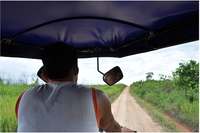 Going on a tuk tuk ride through the long dusty paths of the amazonian roads connecting towns together.