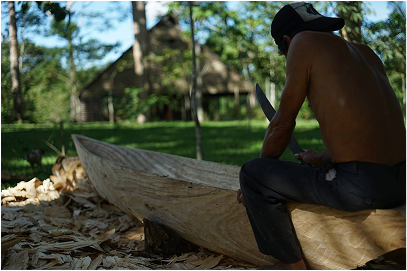 Hand carving a canoe, out of a solid piece of hardwood log with Jose, man with masterful hands.
